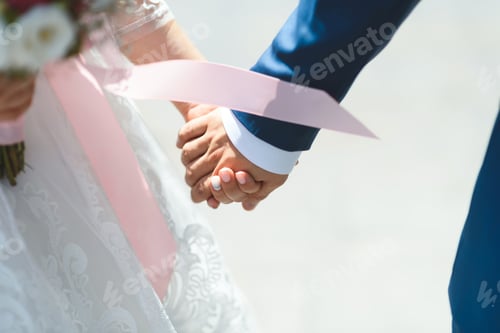 Preview: Bride And Groom Holding Hands In Sunlight In Street