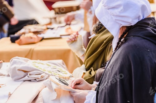 Preview: Artisans Disguised In Medieval Times Showing Old Crafts In A Festival Exhibition.