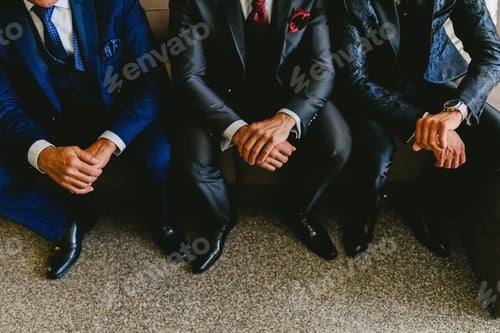 Preview: Hands Of Men Of The Same Family Sitting On A Sofa.