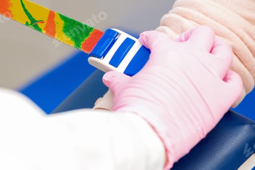 Preview: Nurse Tightens The Harness On The Arm To Take Blood From A Vein For Analysis.