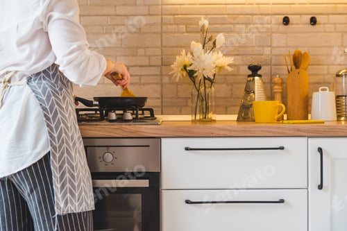 Preview: Woman Fry On Pan Kitchen View. Copy Space