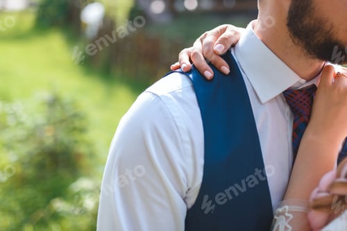 Preview: Woman Holding Hand Over Man'S Neck In Sunlight