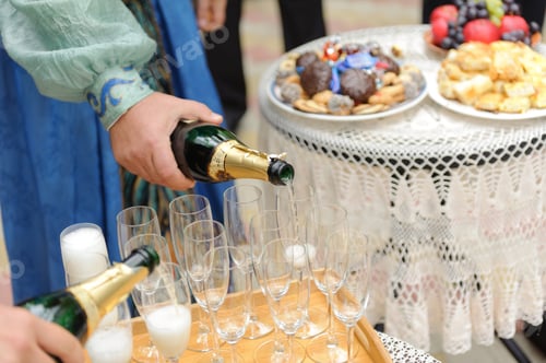 Preview: Men Filling Glasses With Champagne