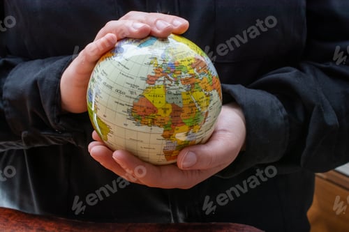 Preview: Person Holding A Globe Model With Their Hands