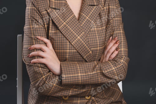 Preview: Woman With Crossed Hands In Plaided Jacket