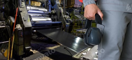 Preview: Worker With Protective Headphone At Man Hands At Industrial Factory