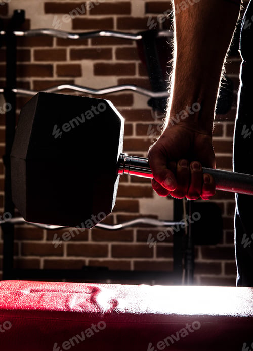Preview: Fit And Muscular Man Doing Biceps Workouts With Dumbbells In Gym, Copy Space.