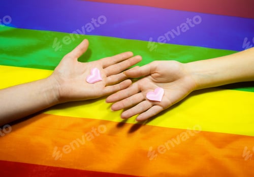 Preview: Lgbt Community Colorful Flag. Two Women'S Hands On Rainbow Background. Lesbian And Gay Problems