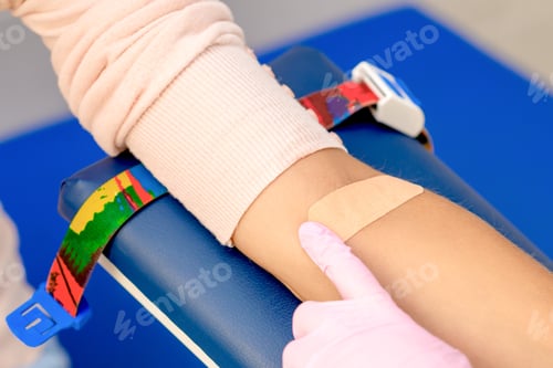 Preview: Nurse Hand Is Glueing An Adhesive Plaster On Arm Wearing Rubber Protective Gloves After Blood