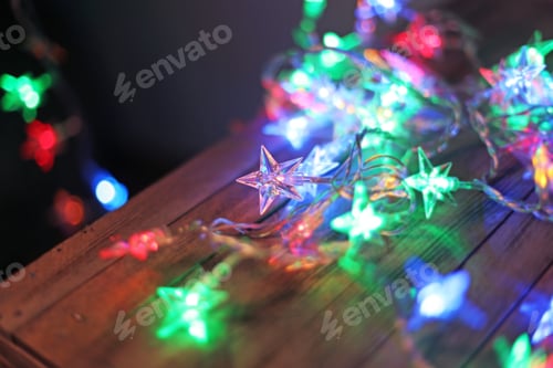 Preview: Star-Shaped Christmas Light Led Lamps Close Up On Wooden Background