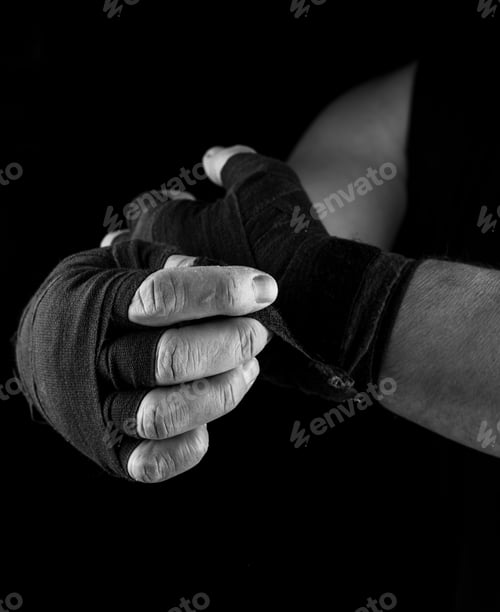 Preview: Man Wraps His Hands In Black Textile Bandage For Sports, Black And White Photo