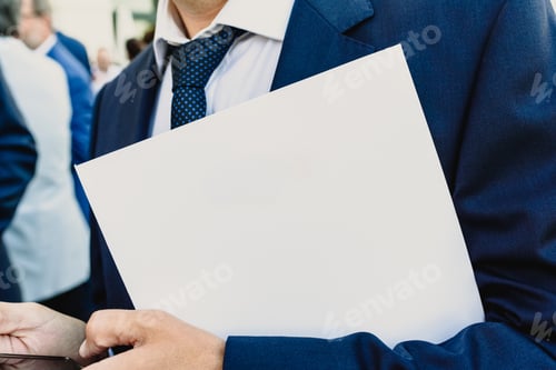 Preview: Businessman With White Folder And Mobil Phone Copy Space