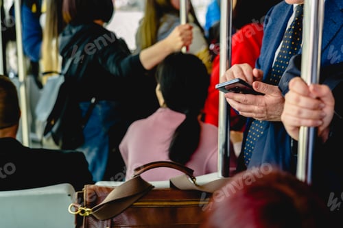 Preview: Businessman Consulting His Mobile Phone While Traveling By Subway To Take Advantage Of Time.