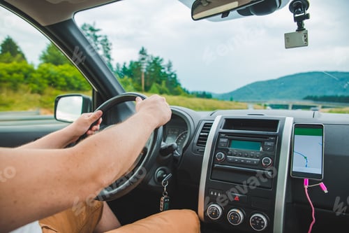 Preview: Young Man Driving Car By Highway. Navigation On The Phone. Road Trip
