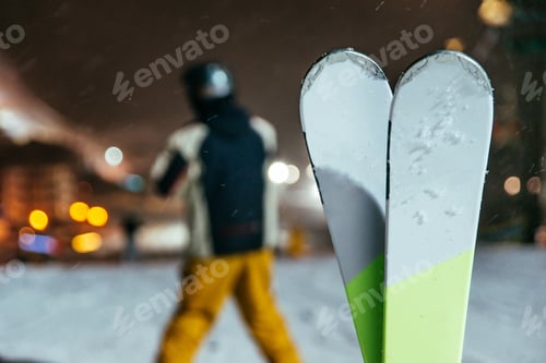 Preview: Ski On The Top Of The Hill In Evening Time Blurred Man On Background