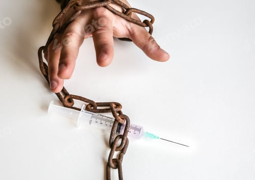 Preview: Man'S Hands In Old Rusty Chains Near The Syringe With Needle. Addicted To Drugs. Dangerous Habit.