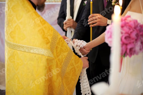 Preview: Bride And Groom Holding Hands During Church Wedding Ceremony