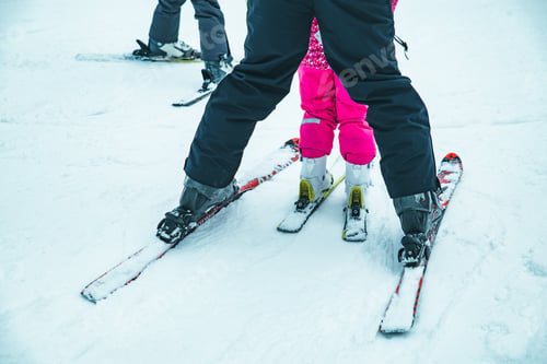 Preview: Bukovel, Ukraine - December 9, 2018: Legs Of Skiing People Close Up. Winter Vacation
