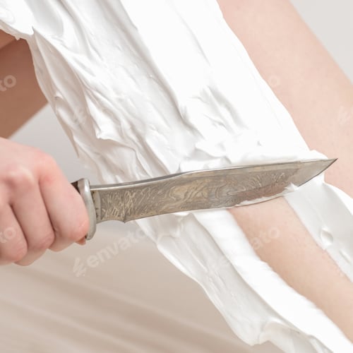 Preview: Female Beautiful Legs Of Young Woman With Foam During Shaving By Knife On White Background