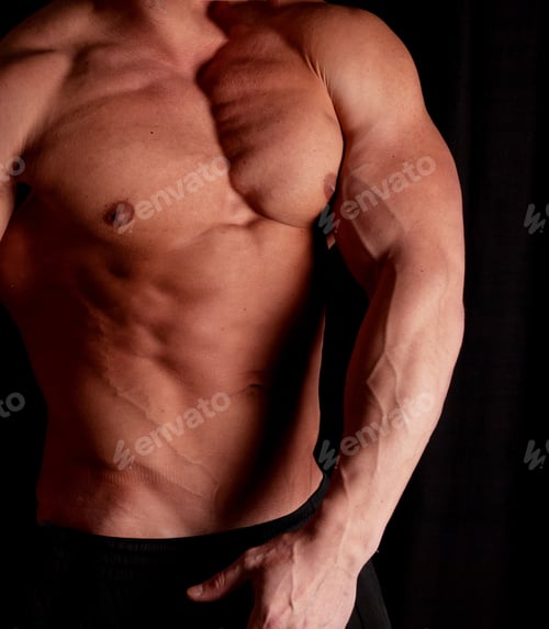 Preview: Muscular Male Torso Of Bodybuilder On Black Background
