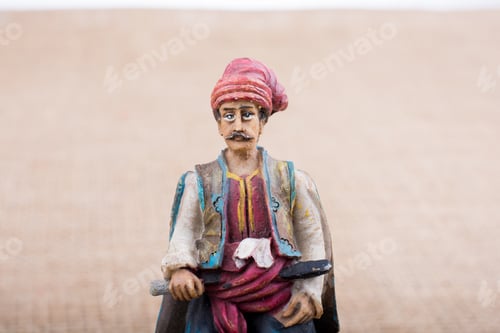 Preview: Turkish Ottoman Man Figurine In View On A Brown Backgorund