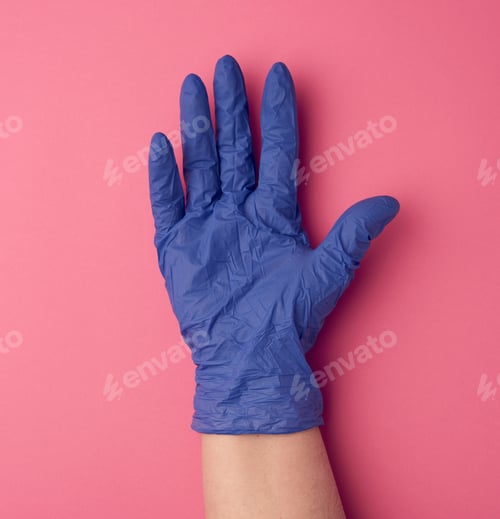 Preview: Blue Medical Glove Is Worn On The Arm, Part Of The Body On A Pink Background, Close Up