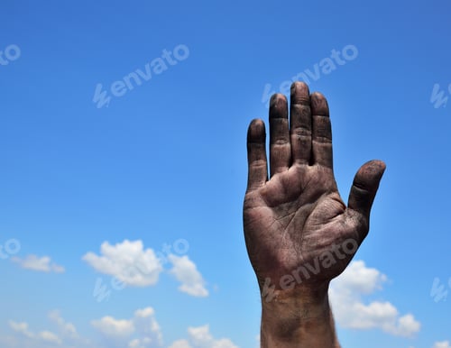 Preview: Dirty Male Palm Raised Up Against A Blue Sky With Clouds, Empty Space On The Left