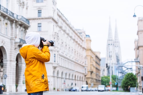 Preview: Photographer Tourist Taking Picture Of City Street With Votive Church On Background Vienna Austria