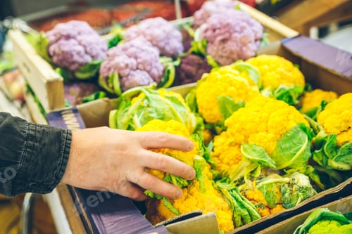 Preview: Shelf At The Market With Cauliflower In Boxes Mans Hand Take One
