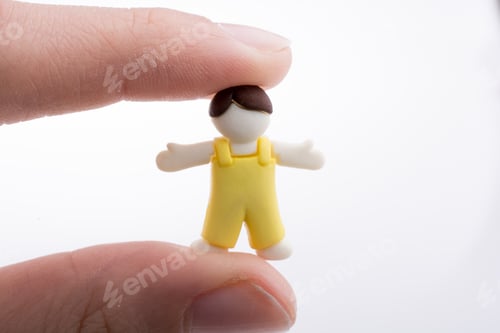 Preview: Hand Holding A Child Figure On A White Background