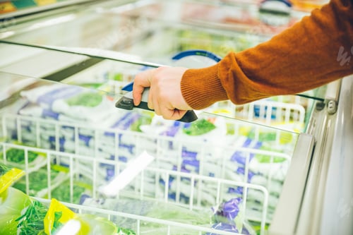 Preview: Man Get Frozen Food From Fridge In Store. Shopping Concept
