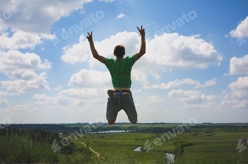 Preview: Young Hipster Guys Having Fun In Summer Holidays. Sporty Man Is Jumping High On The Hill With A