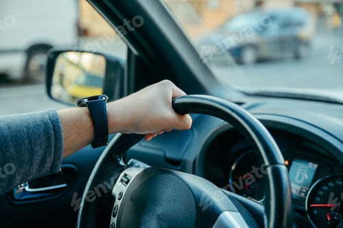 Preview: Man Driving Car By City Streets. View From Inside