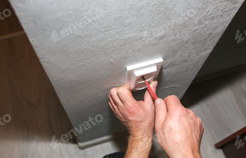 Preview: Man Is Installing The Socket. Electricity Maintenance Repair Works In The Flat. Restoration Indoors.