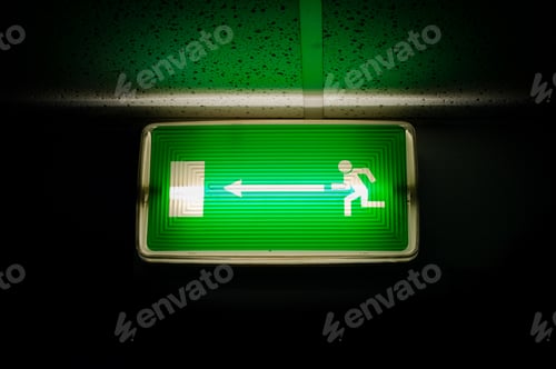 Preview: Glowing Green Escape Light On Dark Background