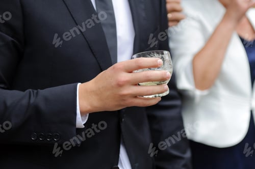 Preview: Man Holding Glass With Champagne