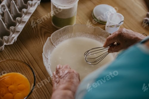 Preview: Adult Woman In The Kitchen Kneading The Mix For Sweets And Desserts