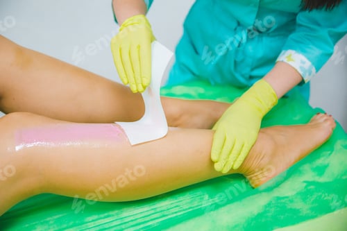 Preview: Woman Making Sugaring In Cosmetic Center. Epilation Beauty Concept. Sexy Legs