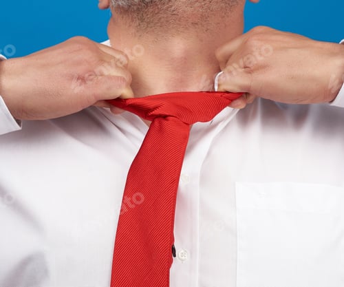 Preview: Man In A White Office Shirt Tears Off A Red Satin Tie From His Neck On A Blue Background, Concept