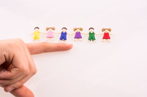 Preview: Hand Near Colorful Dressed Children Figures On A White Background