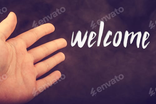 Preview: Hand Making A Welcome Gesture On A Dark Background