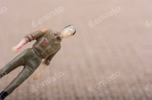 Preview: Toy Soldier Figure on Tan Textured Background
