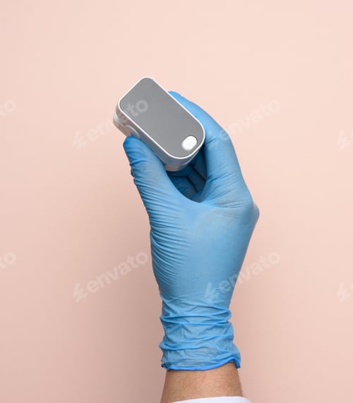 Preview: Electronic Pulse Oximeter In The Hands Of A Doctor, Wearing Blue Latex Gloves, Close Up