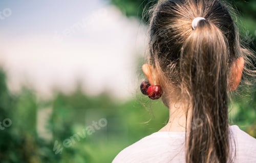 Preview: Girl With Cherries in Ponytail Outdoors