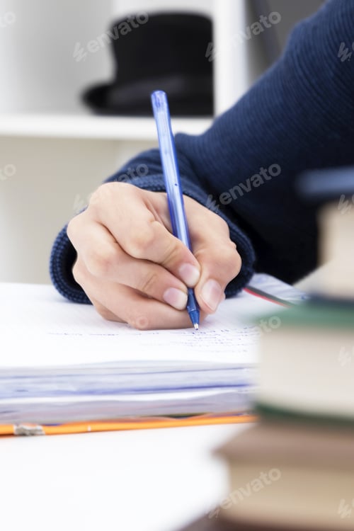 Preview: Closeup Of The Hand Of The Child Writing With The Pen