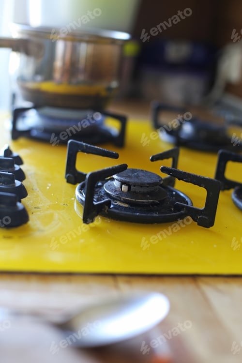 Preview: Black And Yellow Kitchen Stove Selective Focus