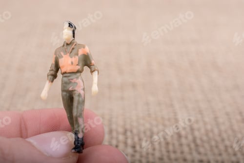 Preview: Miniature Figure on Finger with Blurred Background