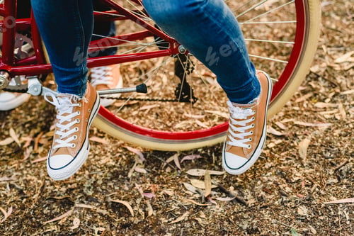 Preview: Couple Of Lovers With Green Sneakers And Jeans Standing Next To A Vintage Bicycle