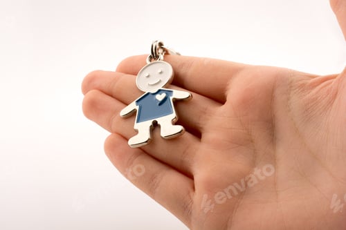 Preview: Man Shaped Keyholder In Hand On White Background