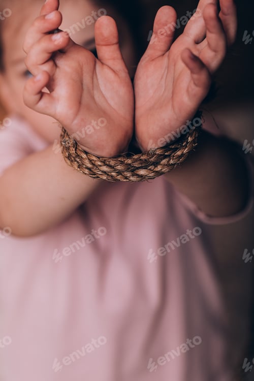 Preview: International Human Rights Or Refugee Day Concept. Closeup Woman Hands Were Tied With A Rope.